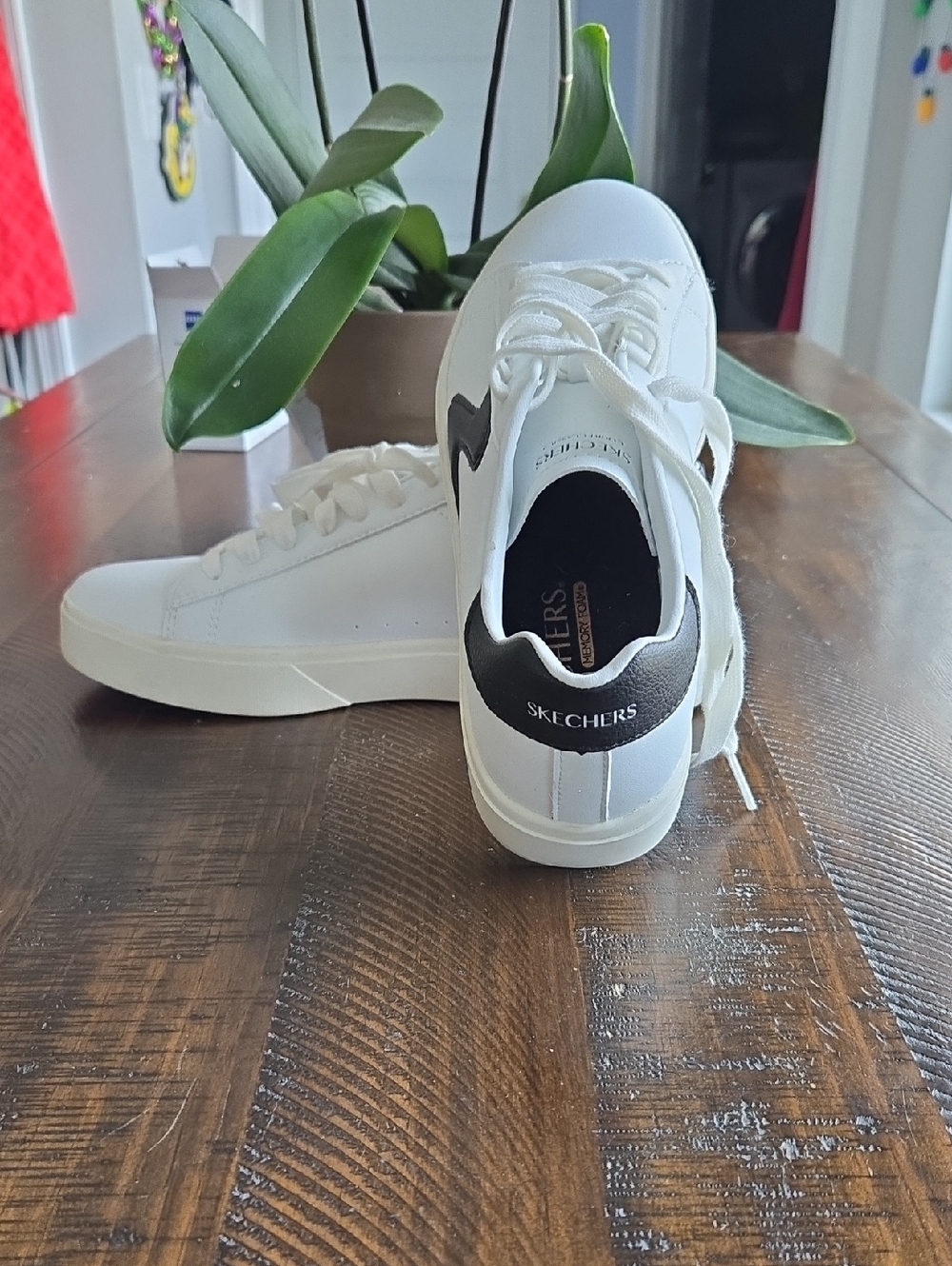 Skechers White Sneakers with Black Heel Accent